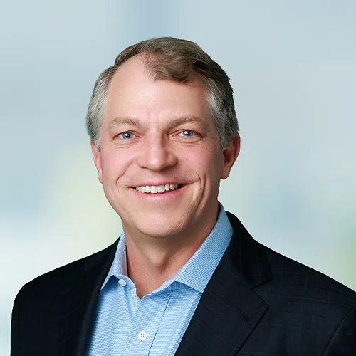 A photo of attorney, Dan Nolan, against a softly blurred office background.