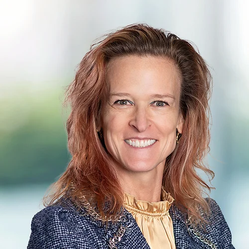 A photo of attorney, Alice Powers, against a softly blurred office background.