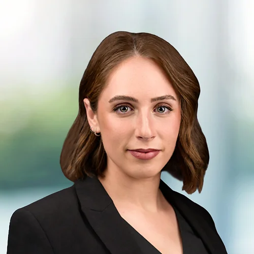 A photo of attorney, Kennedi Fichtel, against a softly blurred office background