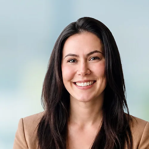 A photo of attorney, Shannon Prokop, against a softly blurred office background