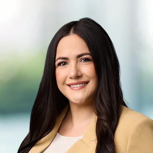 A photo of attorney Elizabeth Petersen against a softly blurred office background