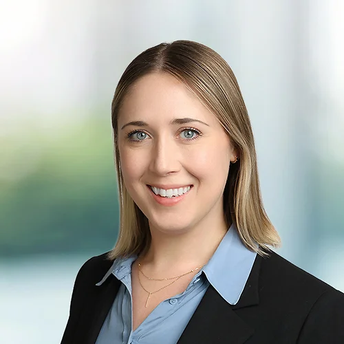 A photo of attorney Elizabeth Castillo against a softly blurred office background
