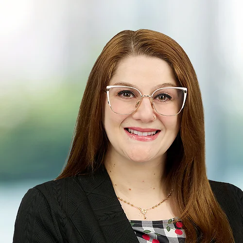 A photo of attorney Samantha Percoraio against a softly blurred office background