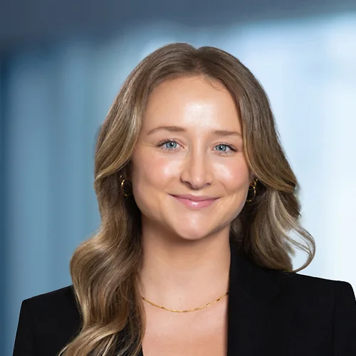 A photo of attorney Allison Miller against a softly blurred office background