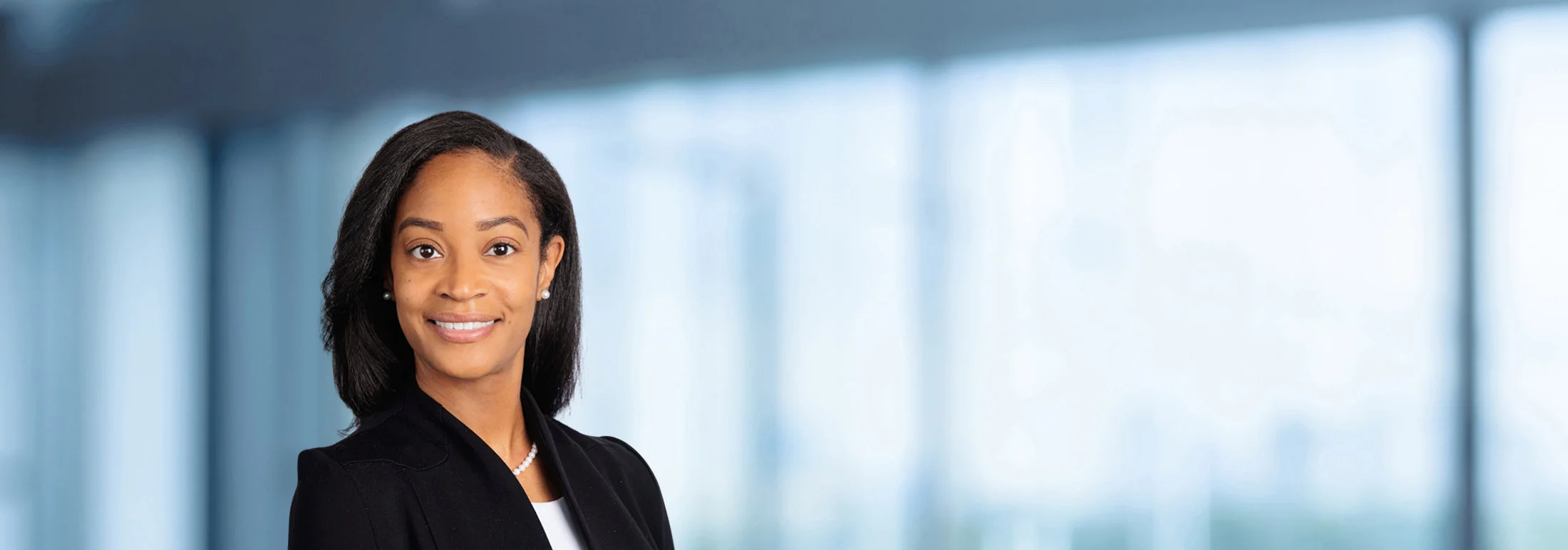 A photo of attorney Tanganica Turner against a softly blurred office background