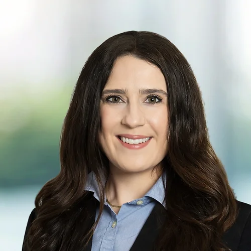 A photo of attorney Elizabeth Martin against a softly blurred office background