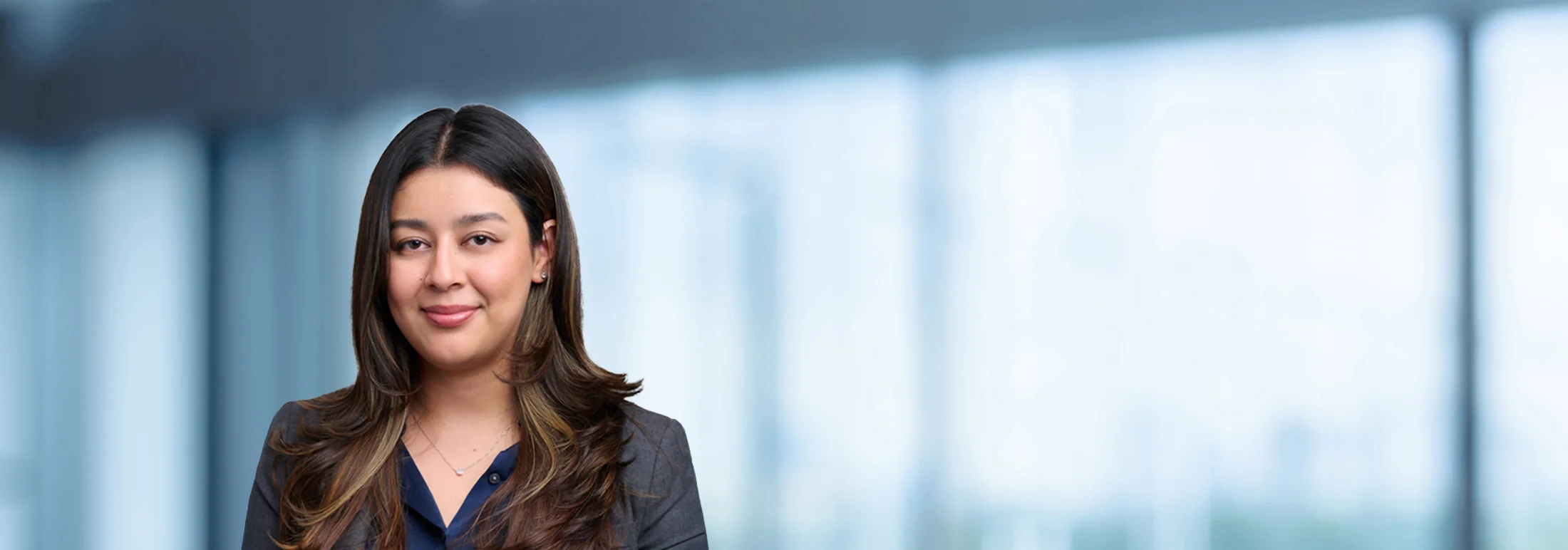 A photo of attorney Paulina Silva against a softly blurred office background