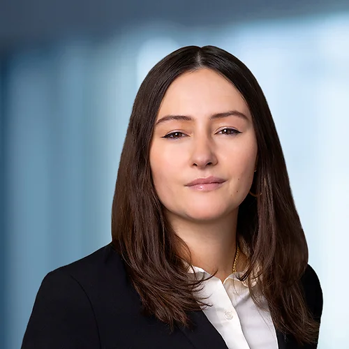 A photo of attorney, Emily Burke-Rodriguez, against a softly blurred office background.