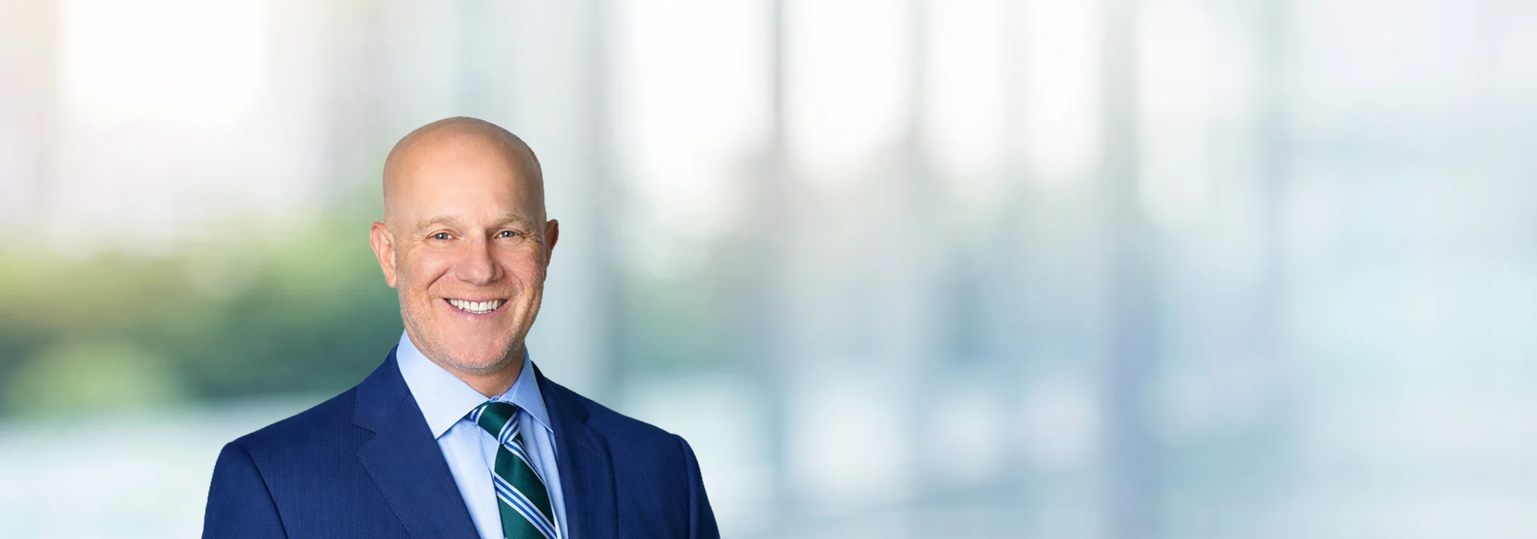 A photo of attorney, Jeff Rosin, against a softly blurred office background.