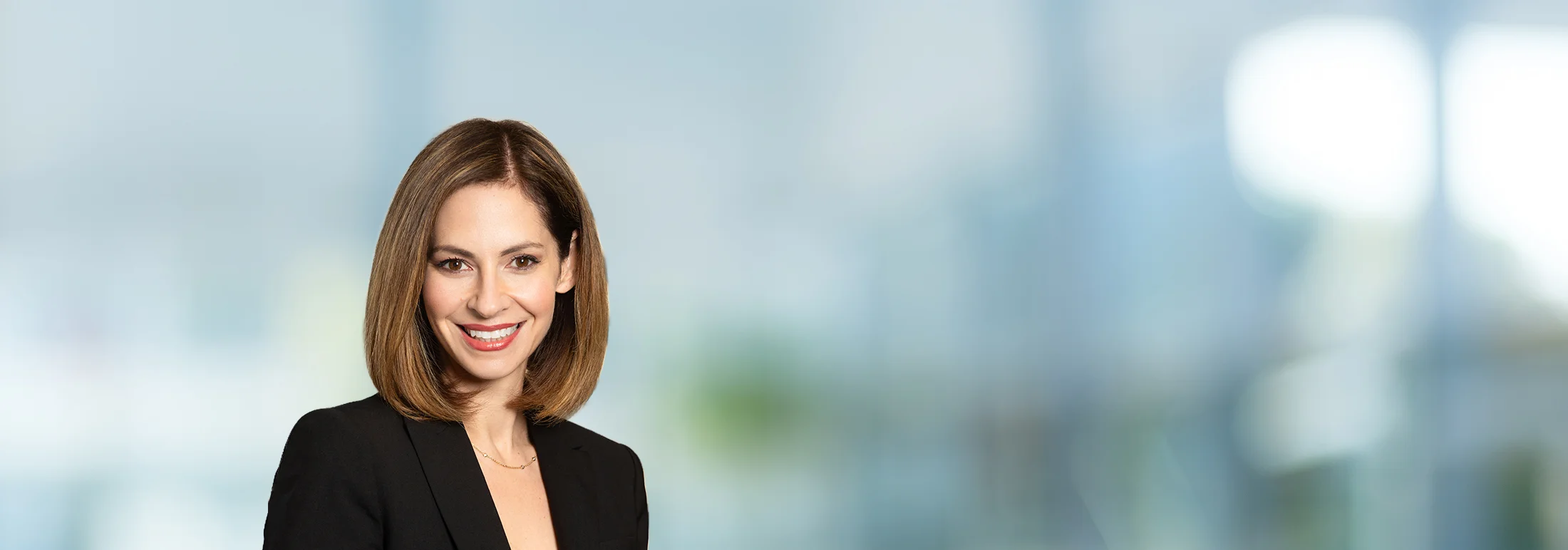 A photo of attorney Melissa Daugherty against a softly blurred office background