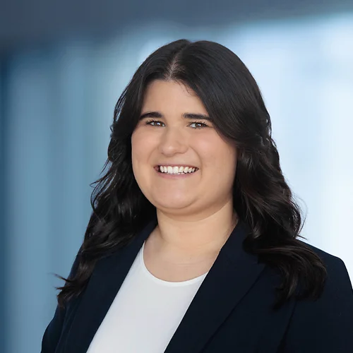 A photo of attorney Emily Walker against a softly blurred office background
