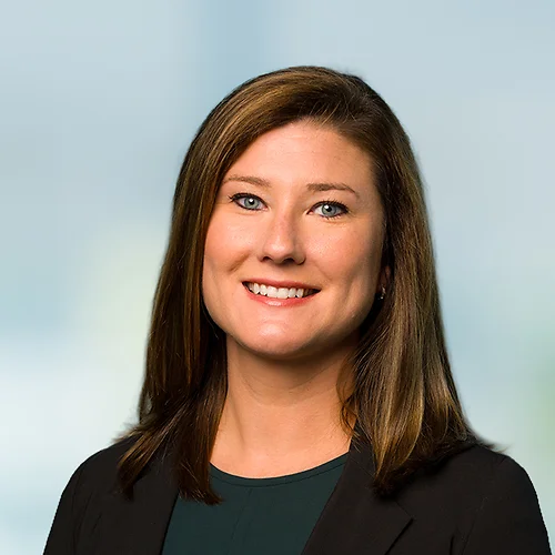 A photo of attorney, Elizabeth Turner, against a softly blurred office background