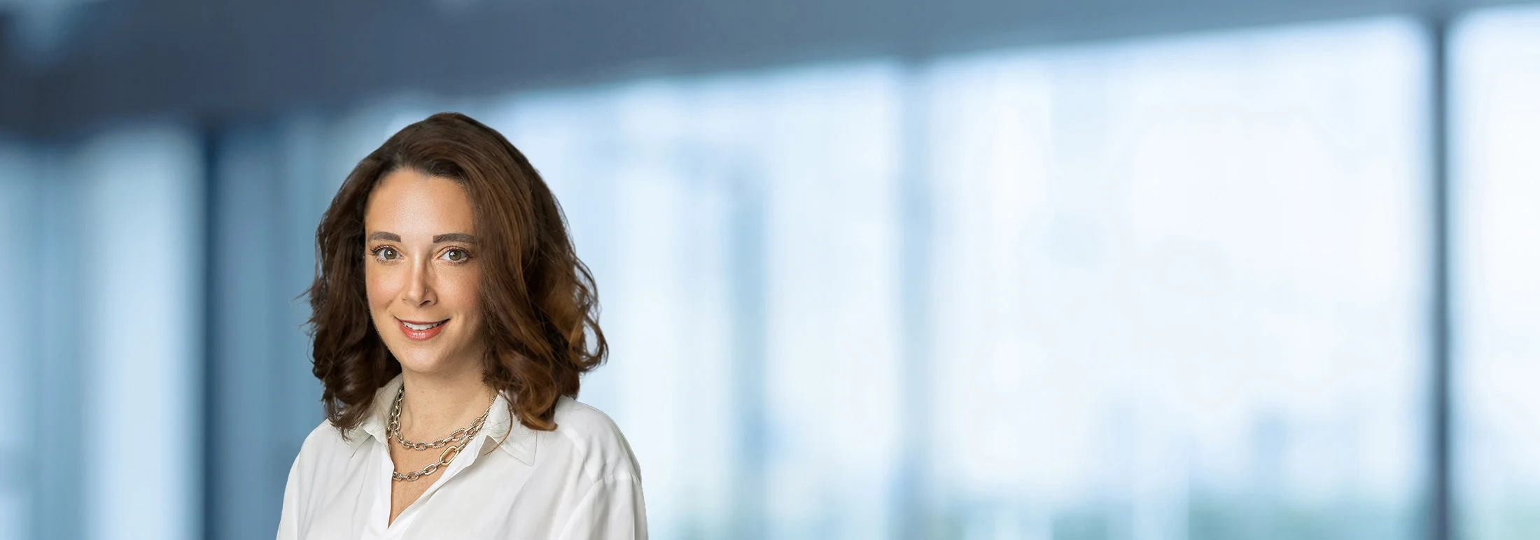 A photo of attorney Sheri Mercier against a softly blurred office background
