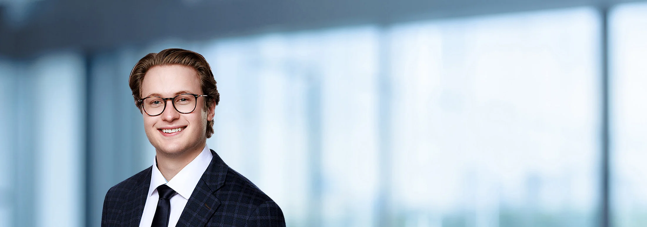 A photo of attorney Nathan Stone against a softly blurred office background
