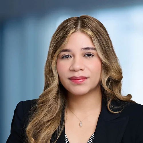 A photo of attorney Brianna Morales against a softly blurred office background