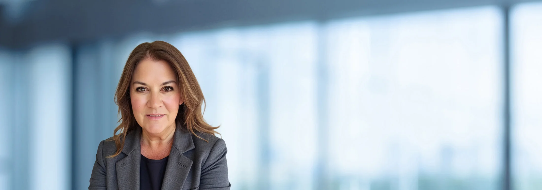 A photo of attorney Michele Barnes against a softly blurred office background