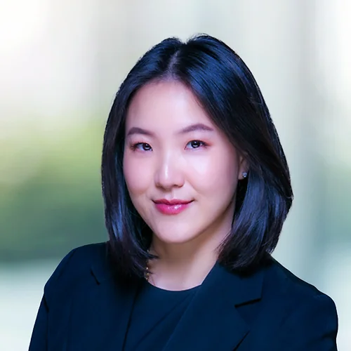 A photo of attorney, Remee Kim, against a softly blurred office background