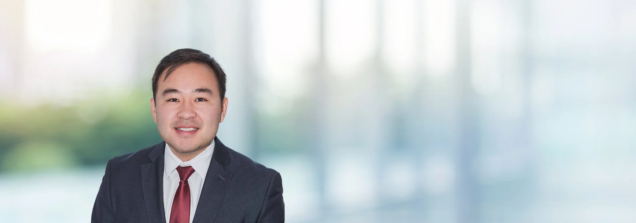 A photo of attorney Yechan Lee against a softly blurred office background