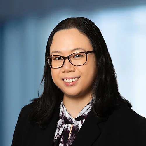 A photo of attorney Chelsea Tiong against a softly blurred office background