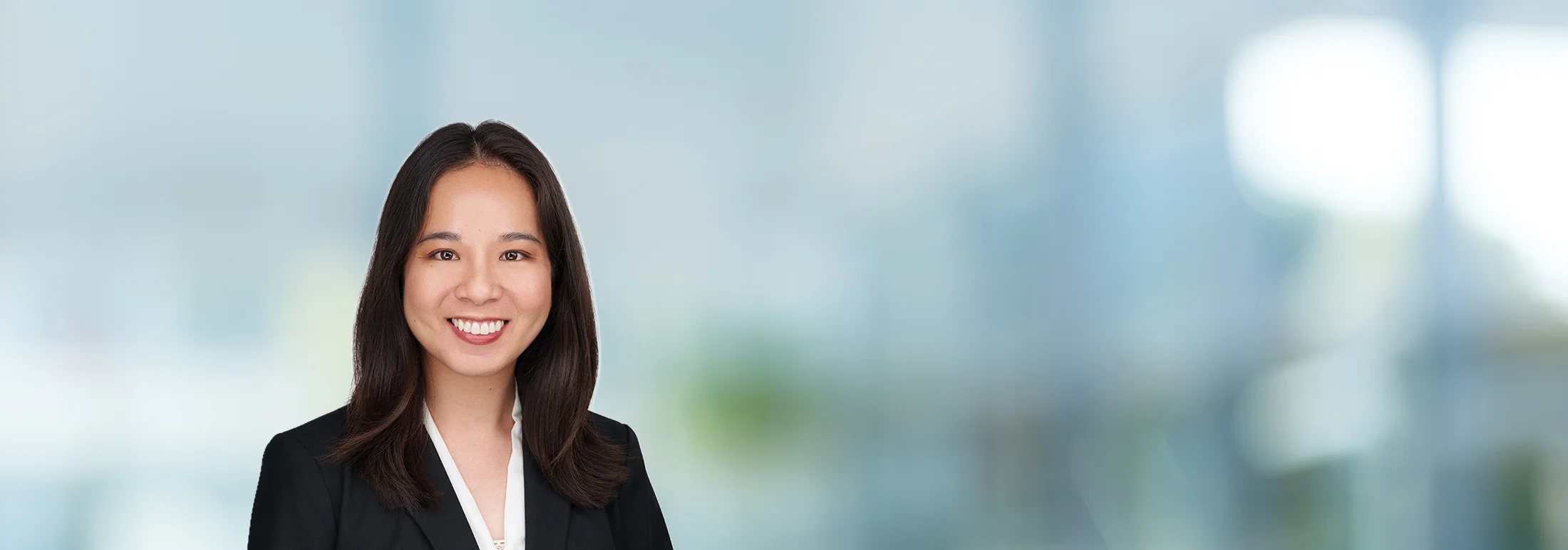 A photo of attorney Bernice Wu against a softly blurred office background