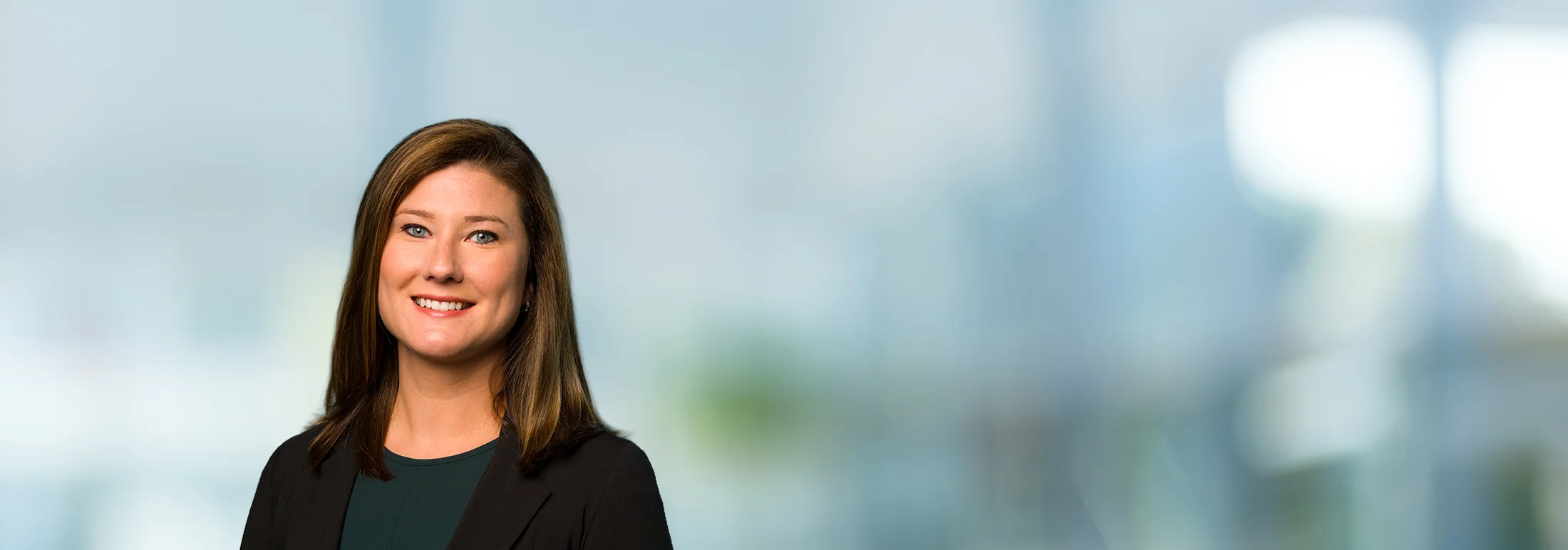 A photo of attorney, Elizabeth Turner, against a softly blurred office background