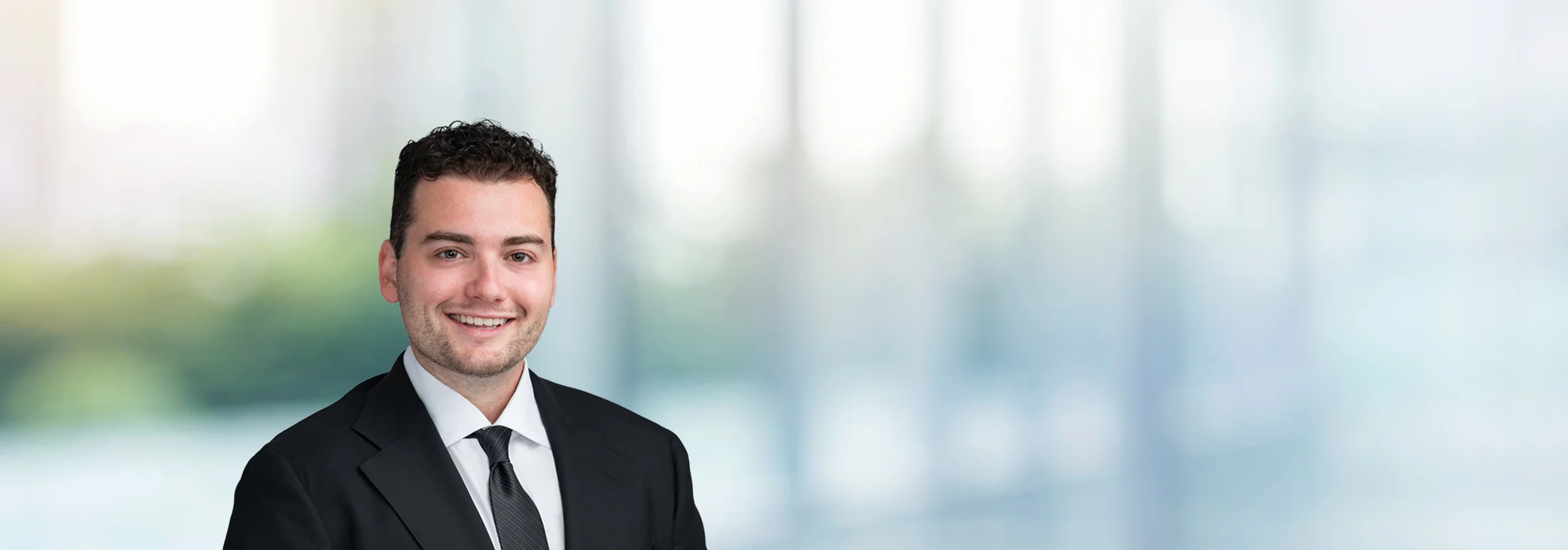 A photo of attorney Sean Stillman against a softly blurred office background