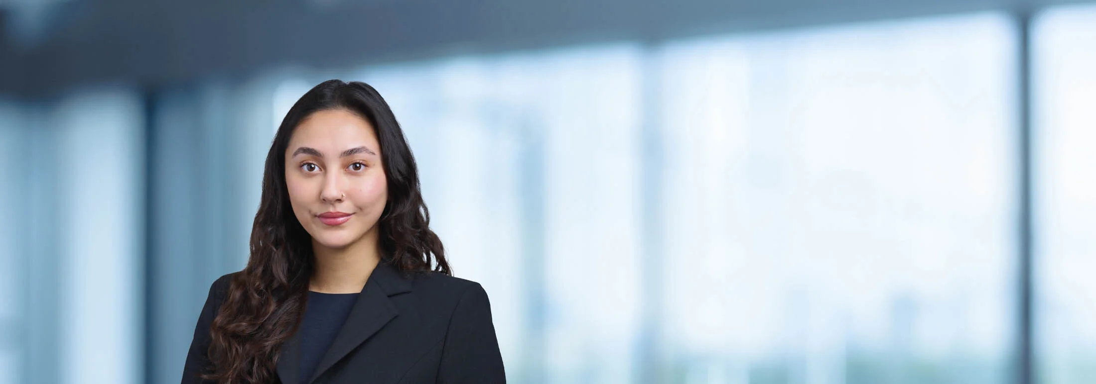 A photo of attorney Kiersten Yamamoro against a softly blurred office background