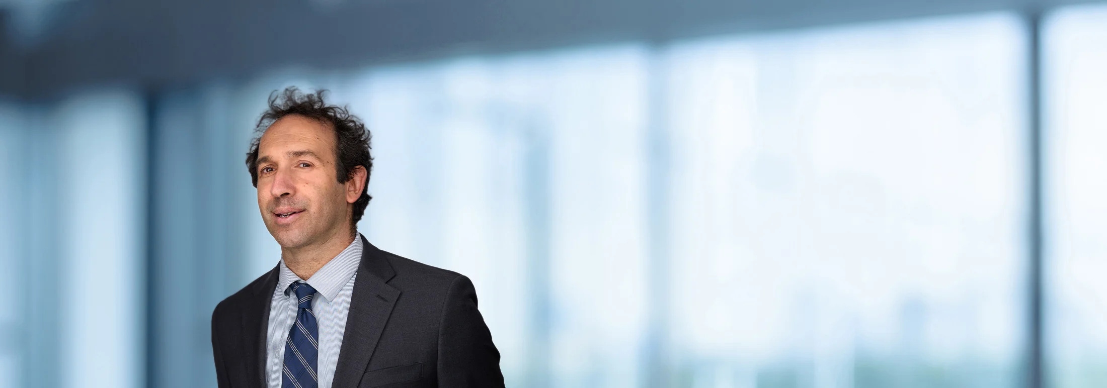 A photo of attorney David Lerch against a softly blurred office background