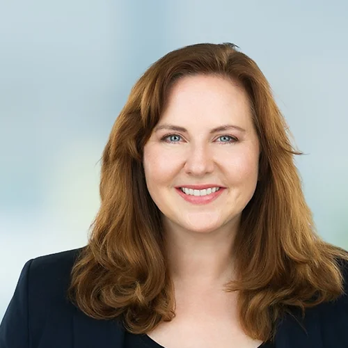 A photo of attorney, Amy Heerink, against a softly blurred office background.