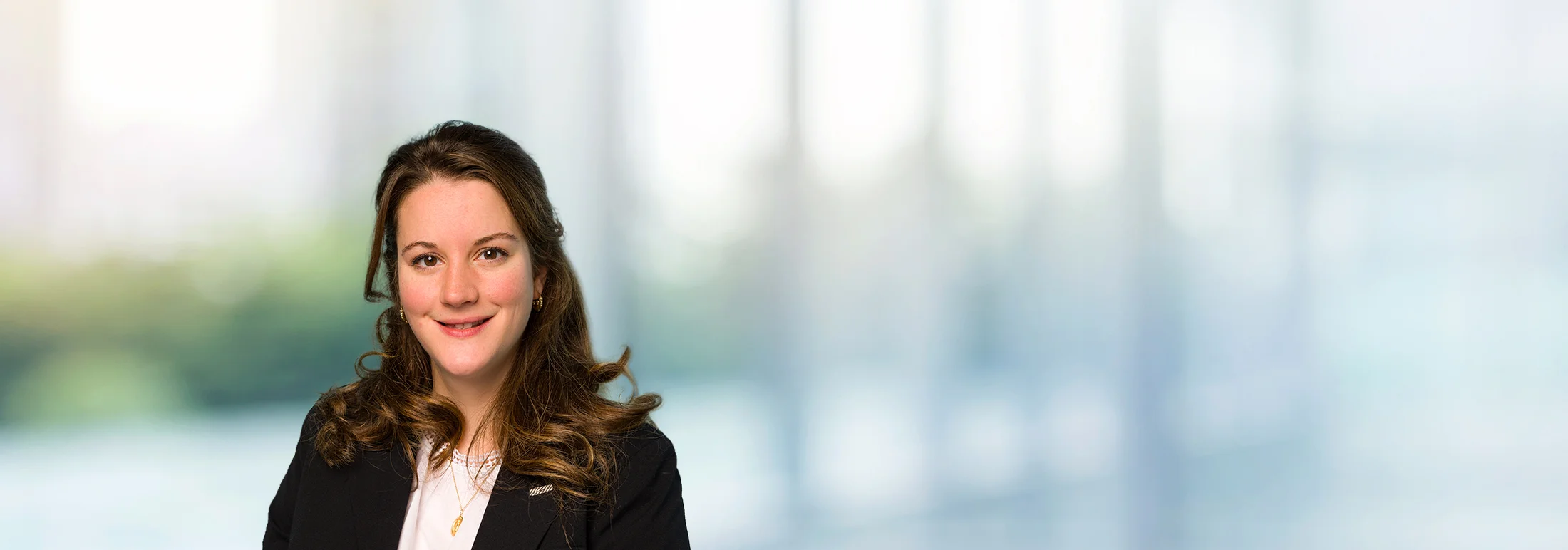 A photo of attorney, Colleen O'Dwyer, against a softly blurred office background.