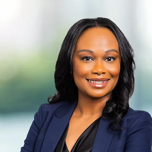 A photo of attorney, Keisha Murray, against a softly blurred office background.