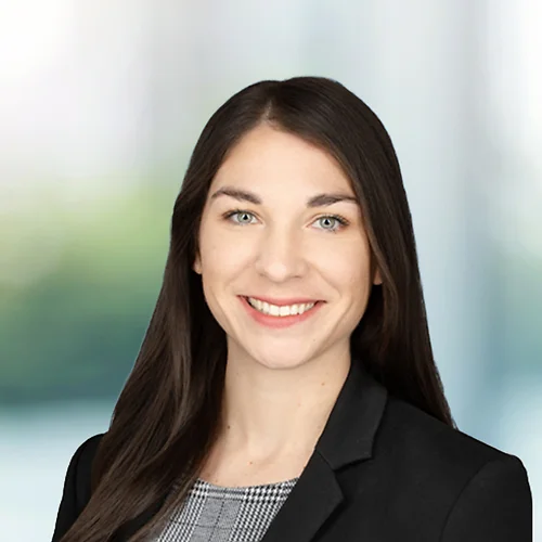 A photo of attorney, Marie Avery, against a softly blurred office background