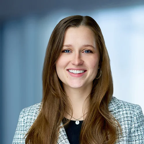 A photo of attorney Ashley Nelson against a softly blurred office background