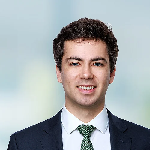 A photo of attorney Andrew Fox against a softly blurred office background