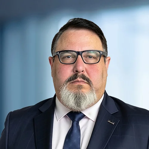 A photo of attorney David Davidson against a softly blurred office background