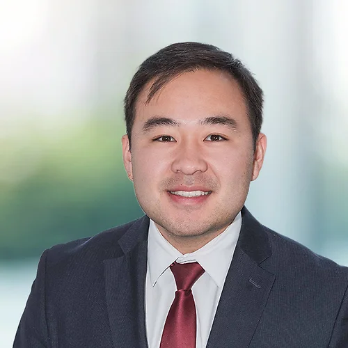 A photo of attorney Yechan Lee against a softly blurred office background