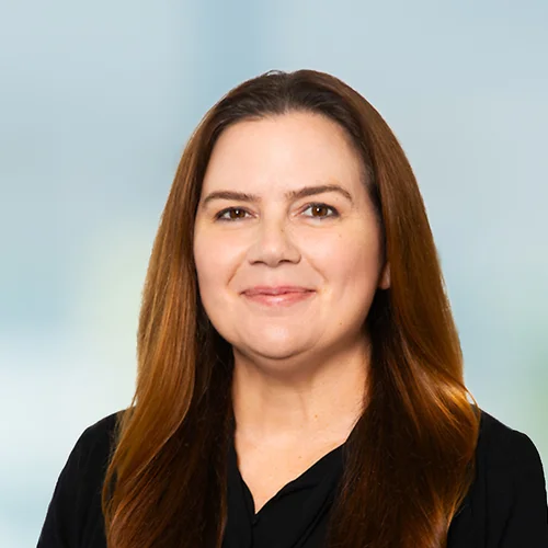 A photo of attorney, Christina Guerin, against a softly blurred office background