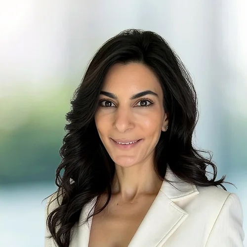 A photo of attorney Maysa Saeed against a softly blurred office background