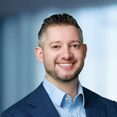 A photo of attorney, Shane Bradwell, against a softly blurred office background.