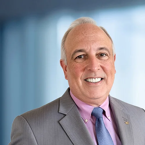 A photo of attorney Tom Shumaker against a softly blurred office background