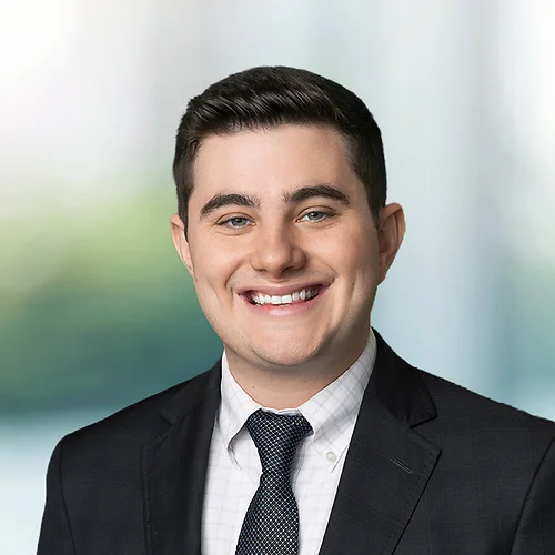 A photo of attorney, Michael Gilger, against a softly blurred office background.