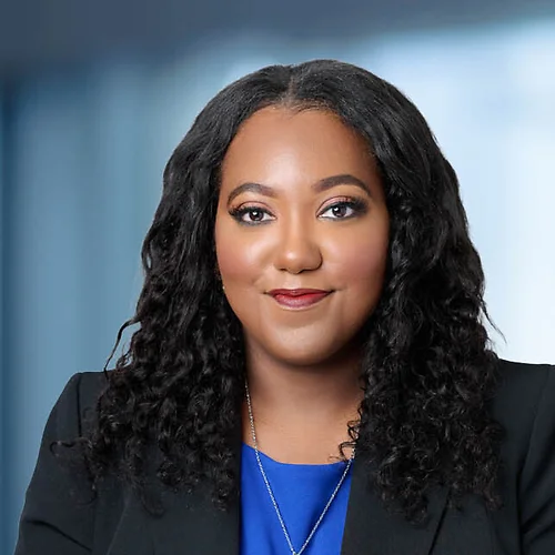A photo of attorney Latrice Burks-Palmerio against a softly blurred office background